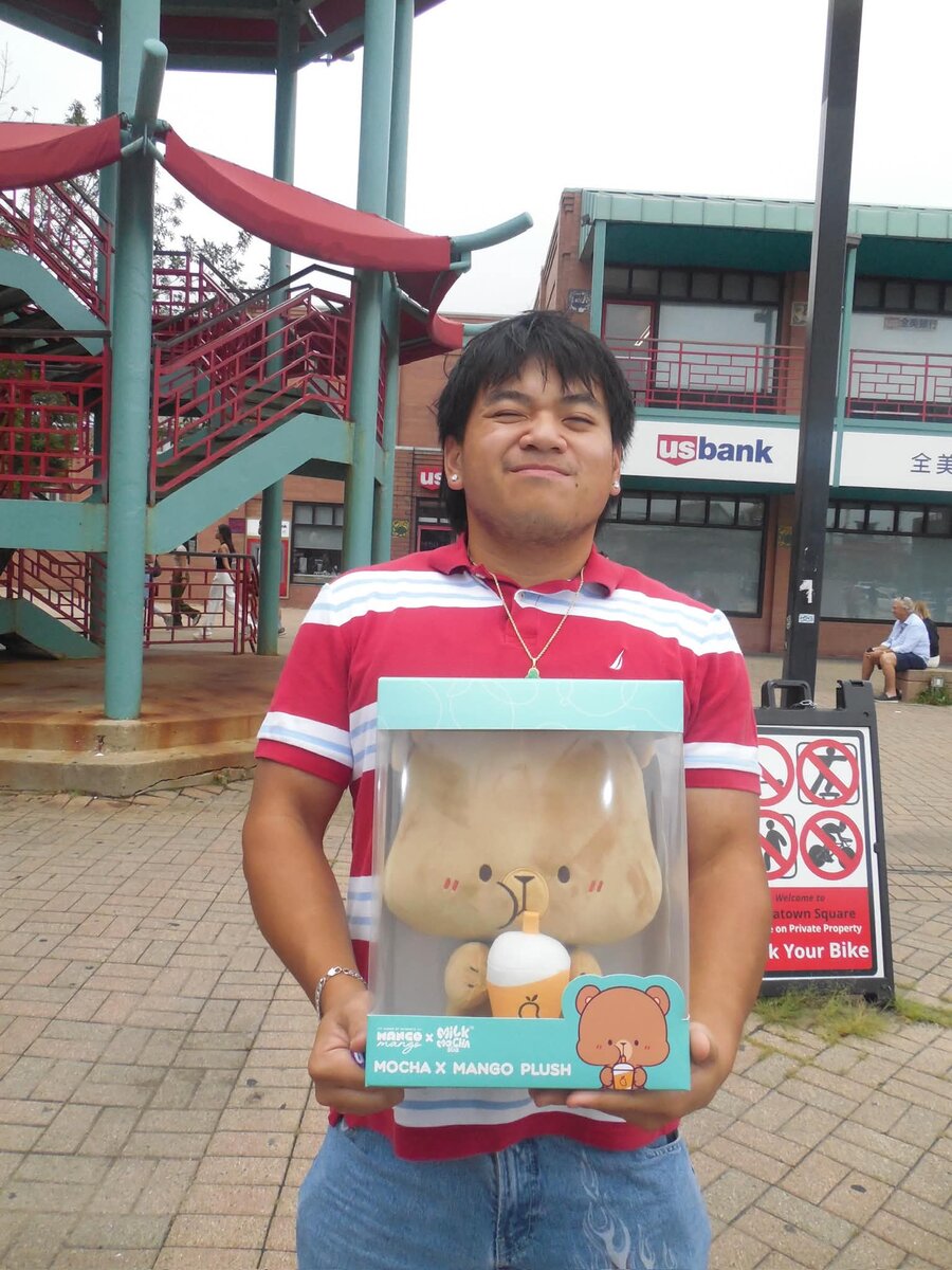 Holding a boba-themed plush at Chinatown Square