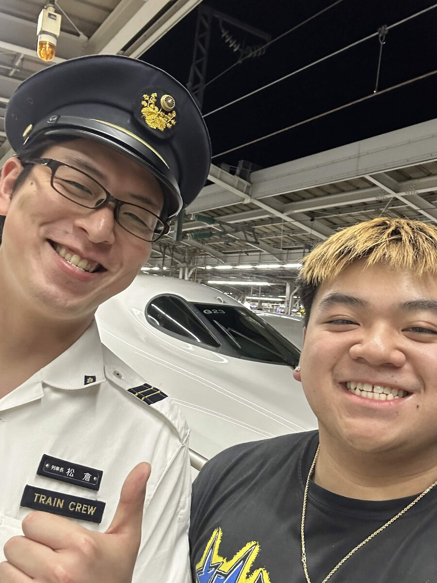 Selfie with a Shinkansen train crew member in front of a bullet train